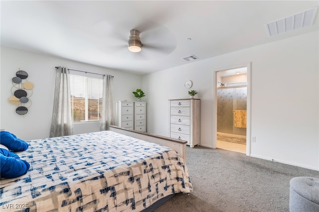 carpeted bedroom featuring ensuite bath, baseboards, visible vents, and a ceiling fan