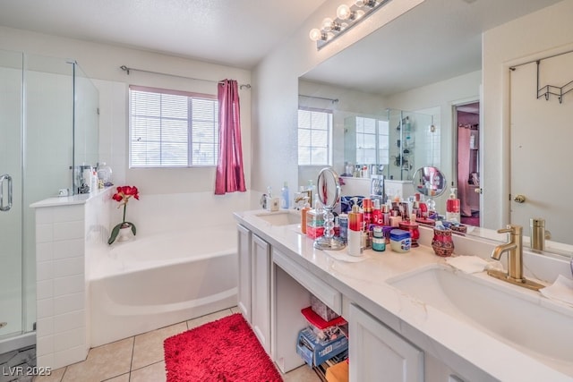 5032 Dancing Lights Ave, Las Vegas, NV 89130 - bathroom featuring a shower stall, a garden tub, double vanity, and healthy amount of natural light