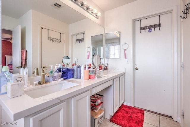 5032 Dancing Lights Ave, Las Vegas, NV 89130 - bathroom with double vanity and tile patterned floors