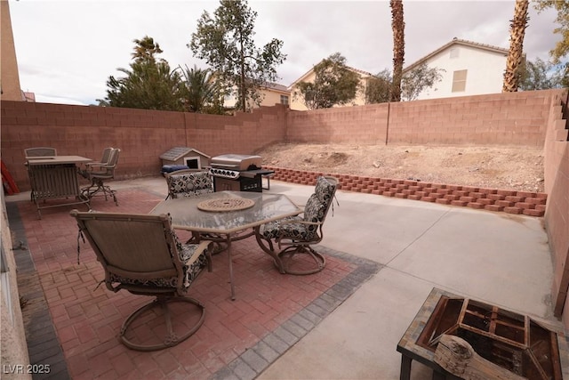 5032 Dancing Lights Ave, Las Vegas, NV 89130 - fenced backyard with outdoor dining area, area for grilling, and a patio area