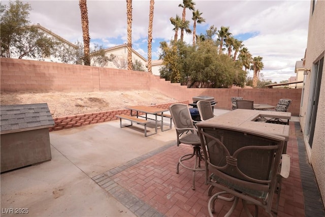 5032 Dancing Lights Ave, Las Vegas, NV 89130 - fenced backyard with a patio and outdoor dining area