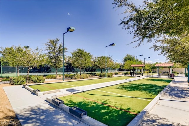 view of community featuring fence