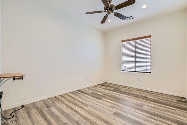 unfurnished room with recessed lighting, baseboards, visible vents, and light wood finished floors