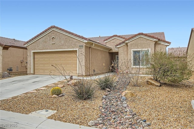 ranch-style home with driveway, a tiled roof, an attached garage, and stucco siding