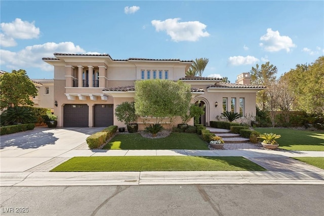 mediterranean / spanish-style house with concrete driveway, a balcony, a tile roof, a front lawn, and stucco siding