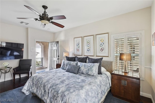 bedroom with a ceiling fan, baseboards, visible vents, and wood finished floors