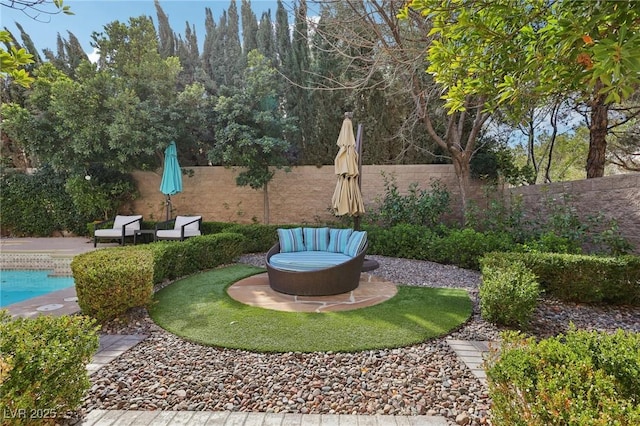 view of yard with a fenced backyard, a fire pit, a fenced in pool, and a patio