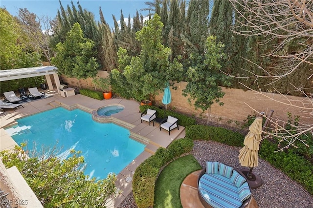 view of swimming pool with a patio area, a fenced backyard, and a pool with connected hot tub