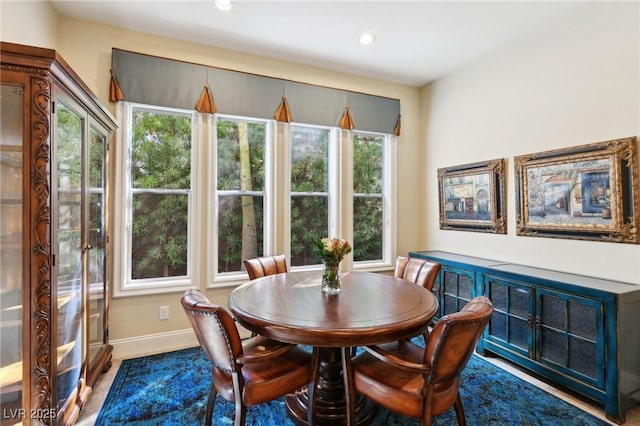 dining area featuring recessed lighting and baseboards