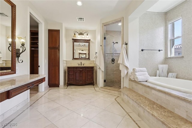 3863 Glasgow Green Dr, Las Vegas, NV 89141 - bathroom with a garden tub, vanity, visible vents, and a shower stall