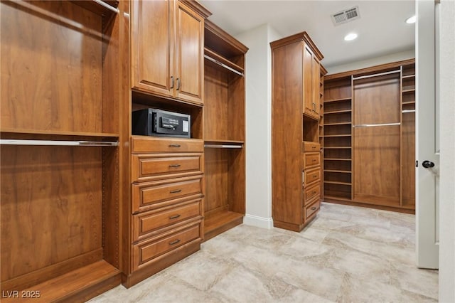 walk in closet with visible vents