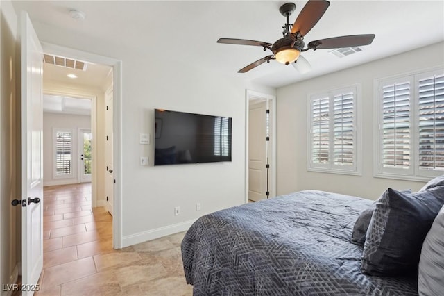 bedroom featuring light tile patterned floors, baseboards, visible vents, and ceiling fan