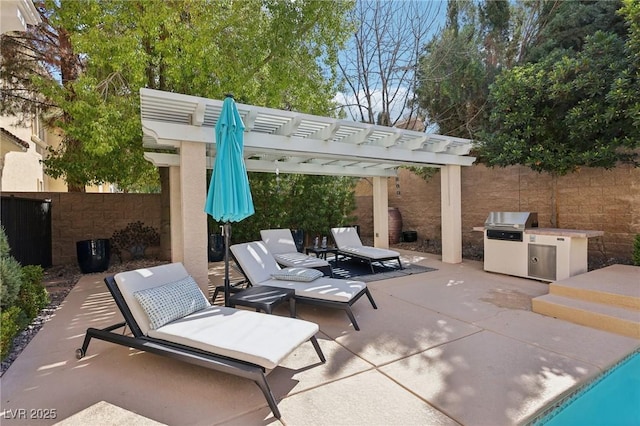 view of patio / terrace featuring exterior kitchen, a grill, fence, and a pergola