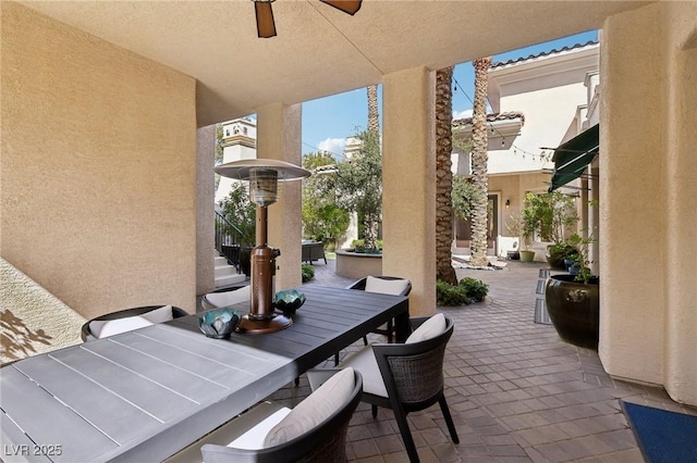 view of patio / terrace featuring ceiling fan and outdoor dining area