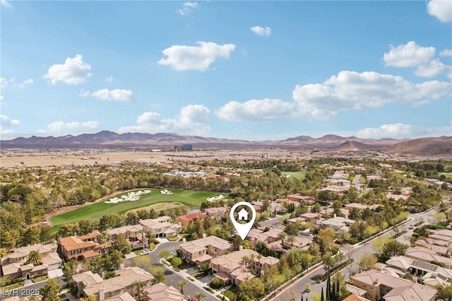 aerial view with view of golf course, a residential view, and a mountain view