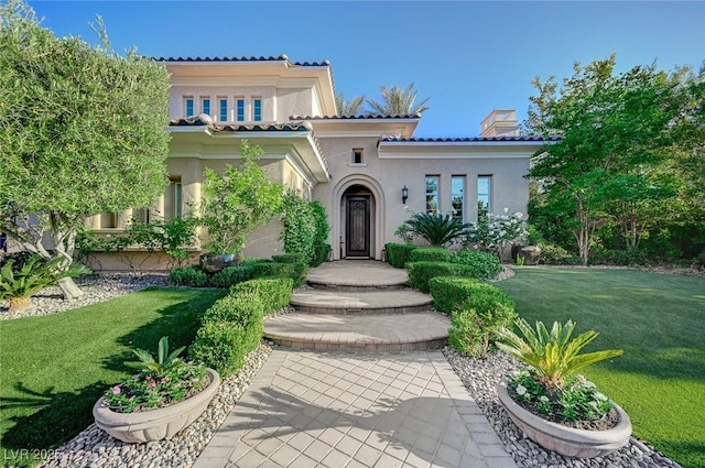 3863 Glasgow Green Dr, Las Vegas, NV 89141 - mediterranean / spanish-style home featuring stucco siding, a tiled roof, and a front lawn