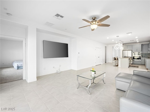 living room featuring recessed lighting, visible vents, ceiling fan, and light tile patterned floors