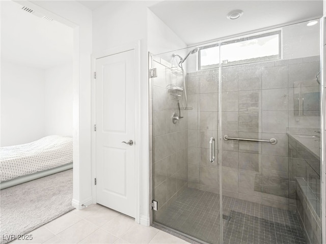 full bathroom with a stall shower, tile patterned flooring, and visible vents