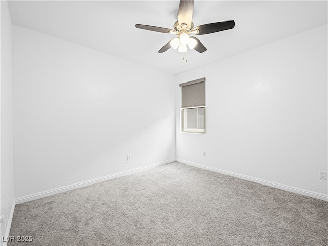 spare room featuring carpet floors, baseboards, and a ceiling fan