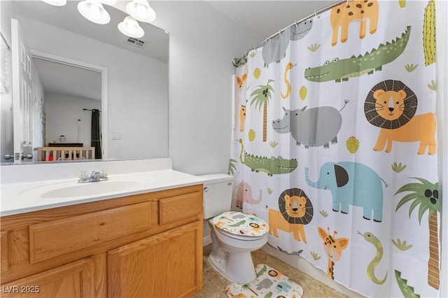 bathroom with vanity, visible vents, curtained shower, tile patterned floors, and toilet