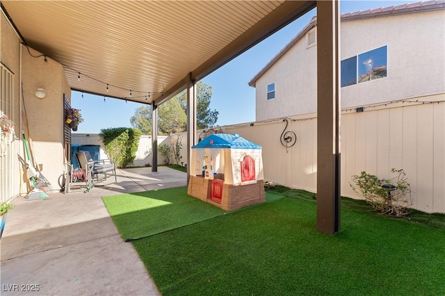 view of yard with a patio and a fenced backyard