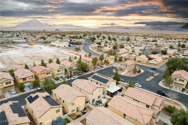 birds eye view of property with a mountain view and a residential view