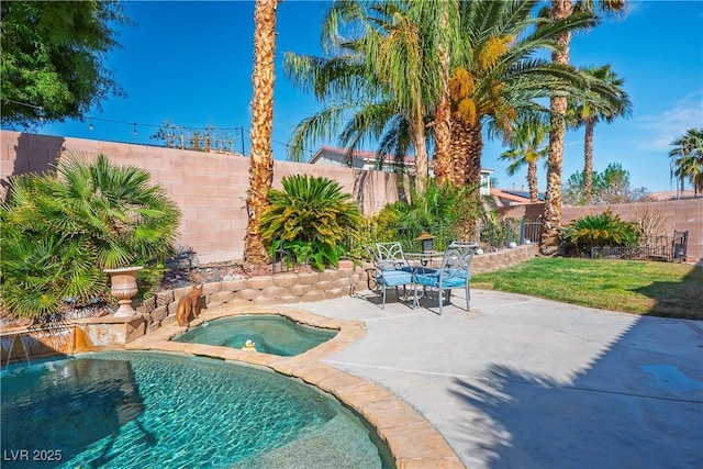 view of swimming pool with outdoor dining space, a fenced backyard, a patio, and an in ground hot tub