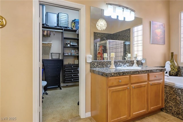 interior space featuring light colored carpet, a sink, and light tile patterned flooring