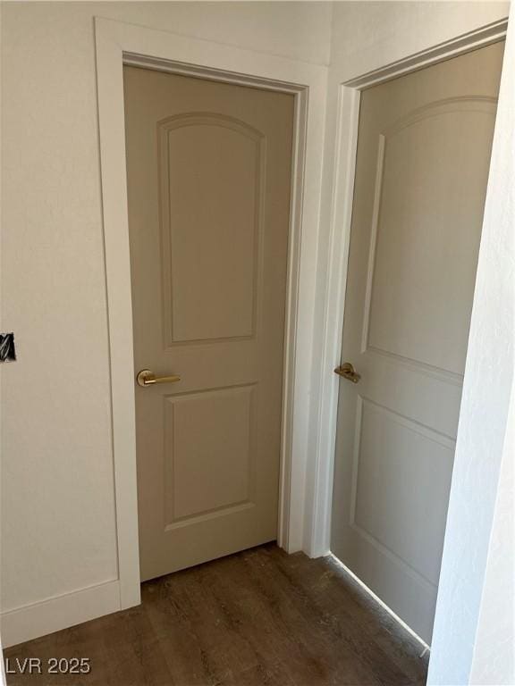 hallway featuring dark wood-style flooring