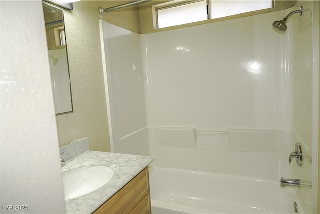 full bath with vanity and bathing tub / shower combination