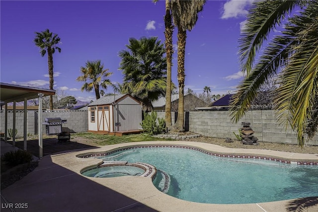 view of swimming pool featuring a pool with connected hot tub, a fenced backyard, grilling area, and a shed