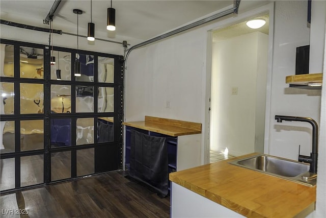 interior space featuring a garage and a sink