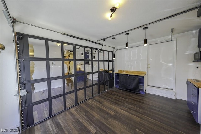 interior space with electric panel and dark wood-type flooring