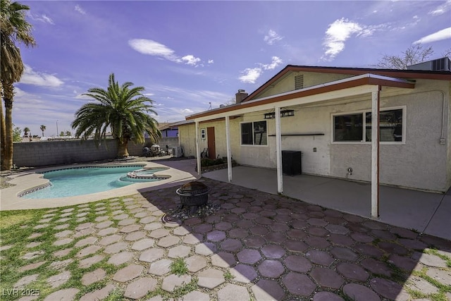 view of swimming pool with a fire pit, a patio area, a fenced backyard, and a fenced in pool