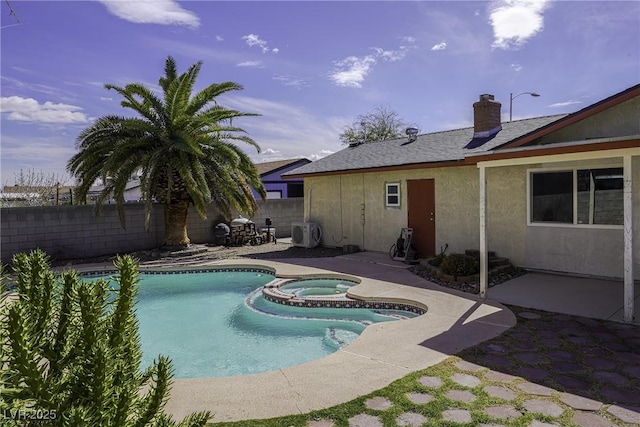 view of swimming pool with ac unit, a patio area, a fenced backyard, and a pool with connected hot tub