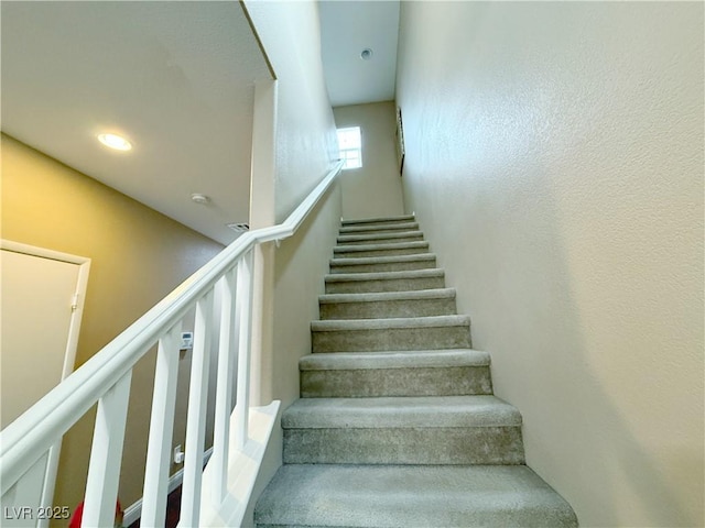 stairs with recessed lighting