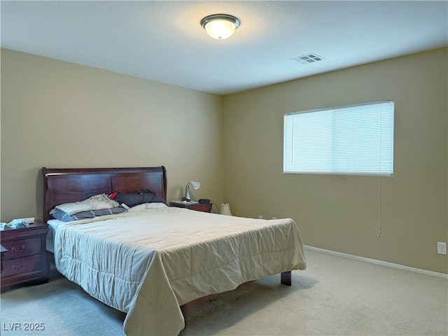 bedroom with baseboards, visible vents, and carpet flooring