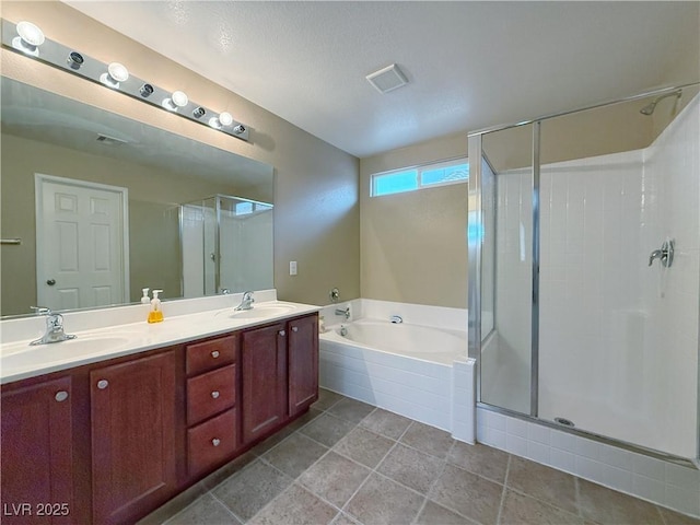 full bathroom featuring double vanity, visible vents, a sink, a shower stall, and a bath