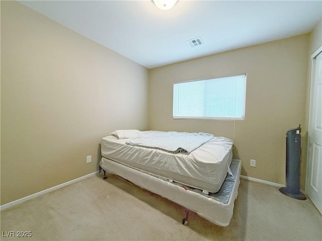 bedroom with carpet flooring, visible vents, and baseboards