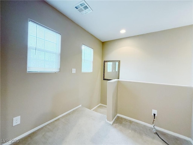 laundry room with carpet, visible vents, baseboards, and recessed lighting