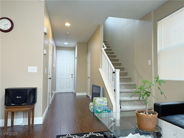 entrance foyer with dark wood finished floors, recessed lighting, visible vents, baseboards, and stairs