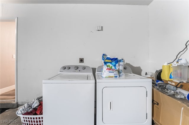 washroom featuring laundry area and washer and clothes dryer