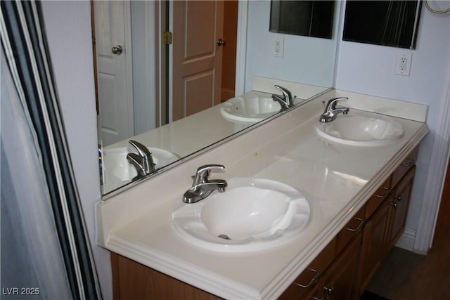 bathroom with a sink and double vanity