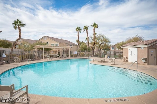 community pool with a residential view, a patio area, fence, and a pergola