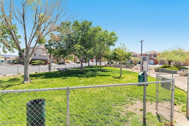 view of yard with fence and a residential view