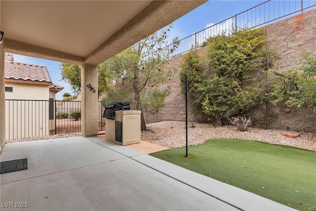 view of patio featuring fence