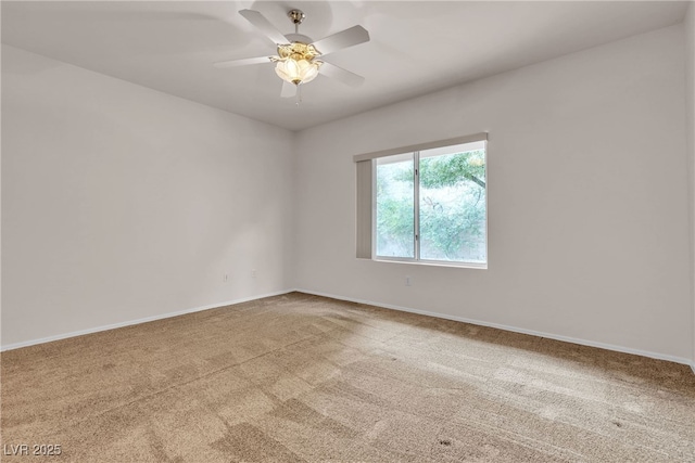 unfurnished room featuring carpet flooring, baseboards, and a ceiling fan