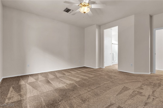 carpeted empty room with a ceiling fan, visible vents, and baseboards