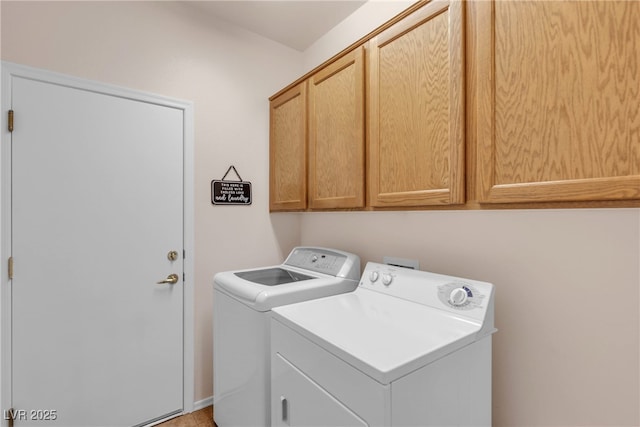 laundry room featuring cabinet space and washer and clothes dryer