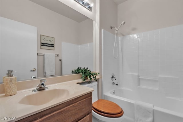 bathroom featuring tub / shower combination, toilet, and vanity